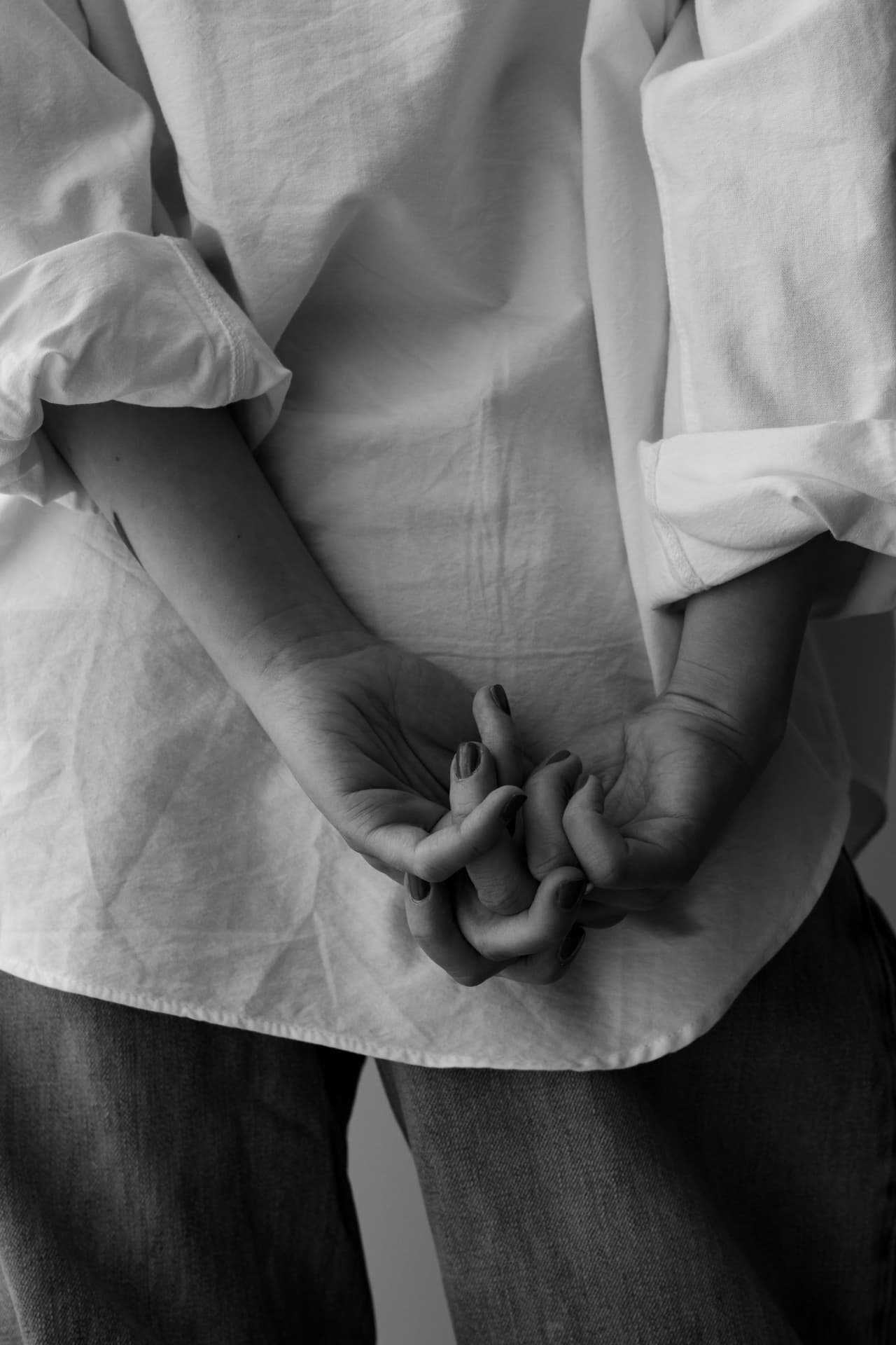 Clasped hands in black and white